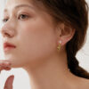 Handshaped Earrings with Organic Pearls - Image 3