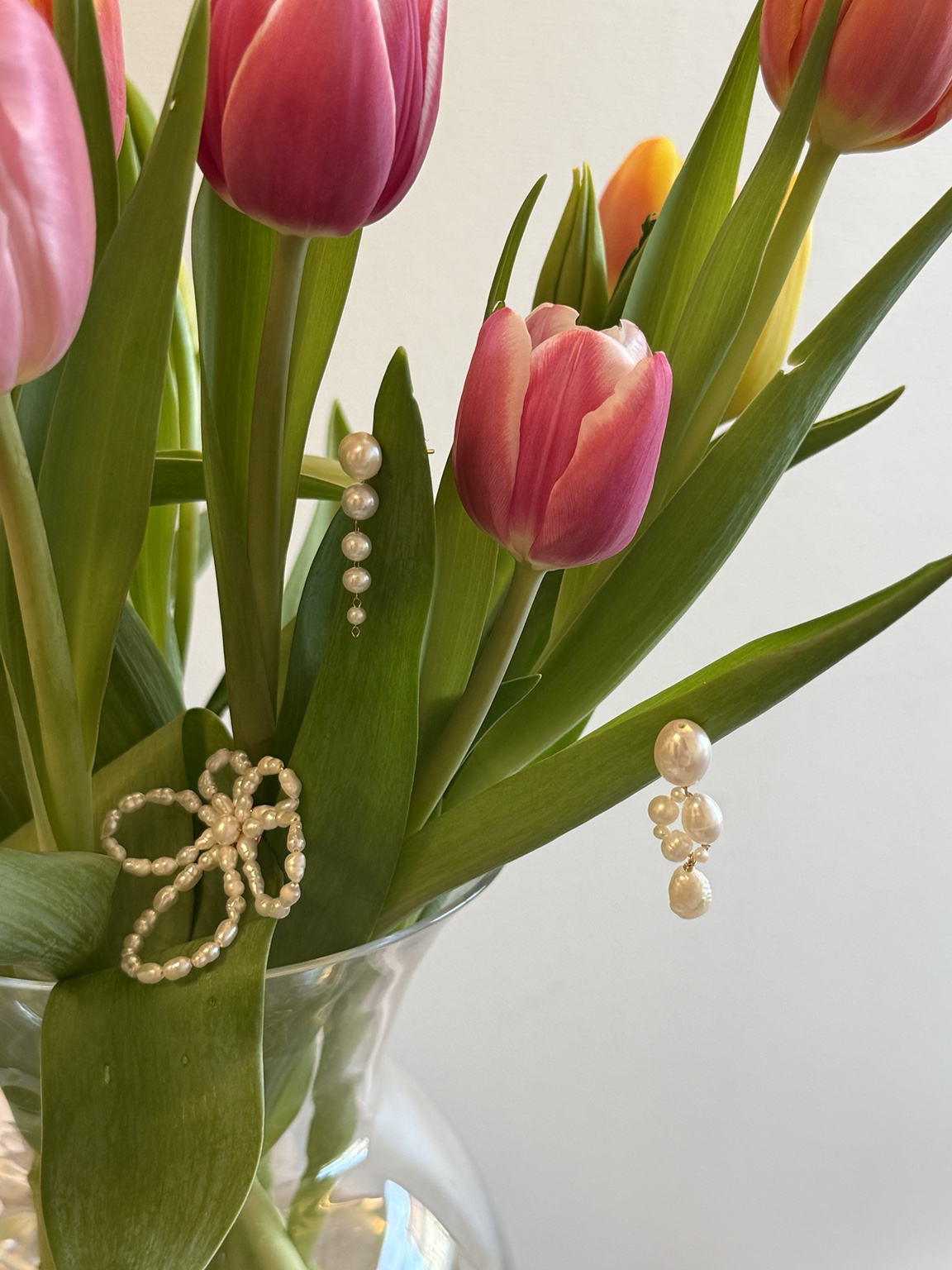 CHEZ LOLA pearl earrings photographed with tulips