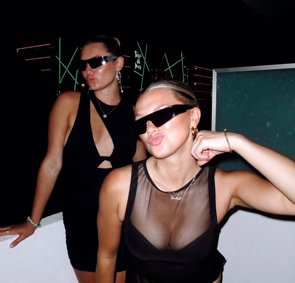 Friends wearing CHEZ LOLA jewellery on a night out