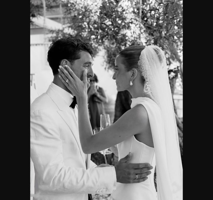 Bride wearing pearl earrings by CHEZ LOLA